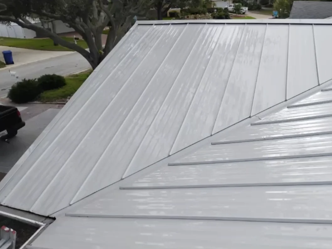 Professional roof washing removing algae and moss buildup